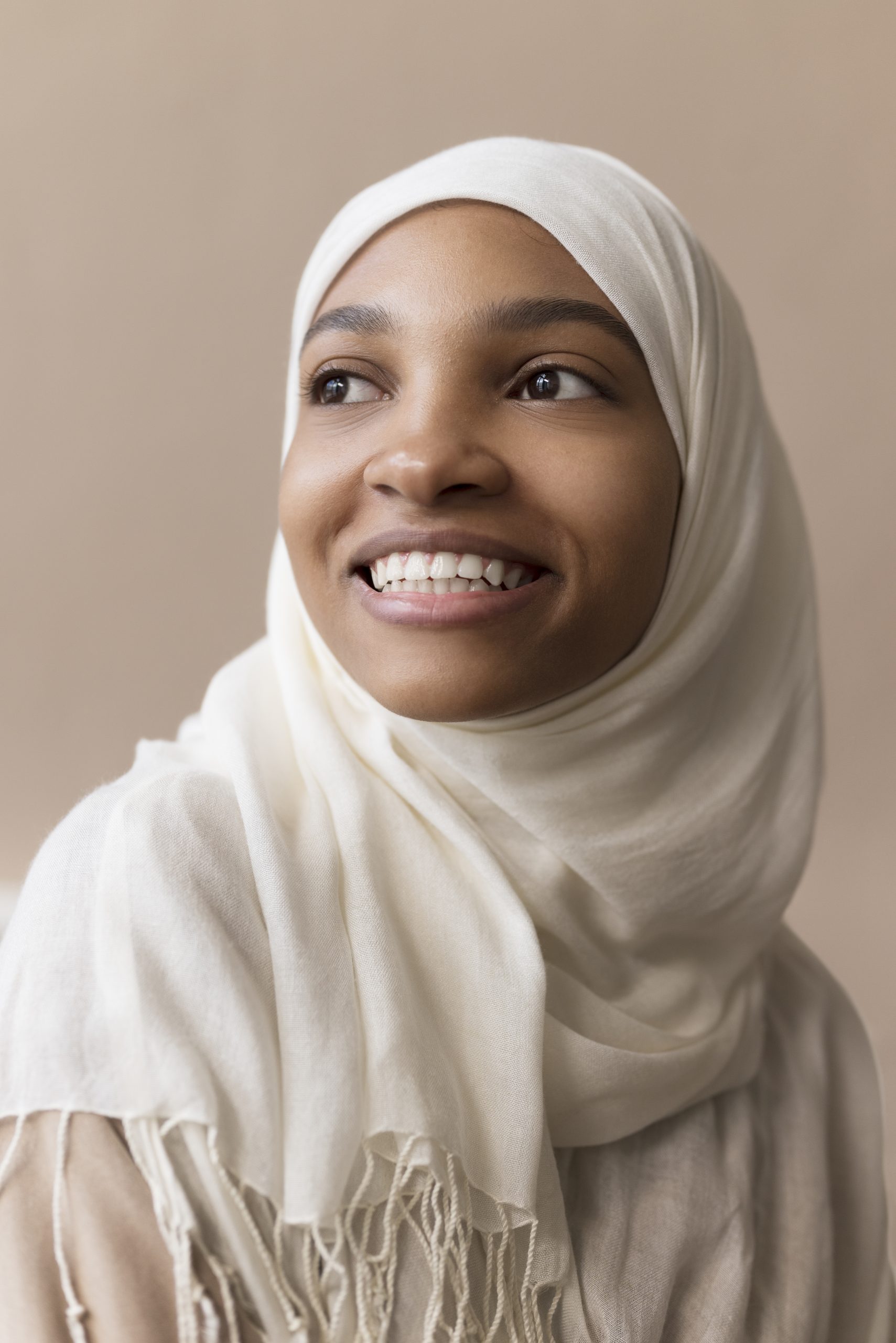 medium shot smiley woman with hijab